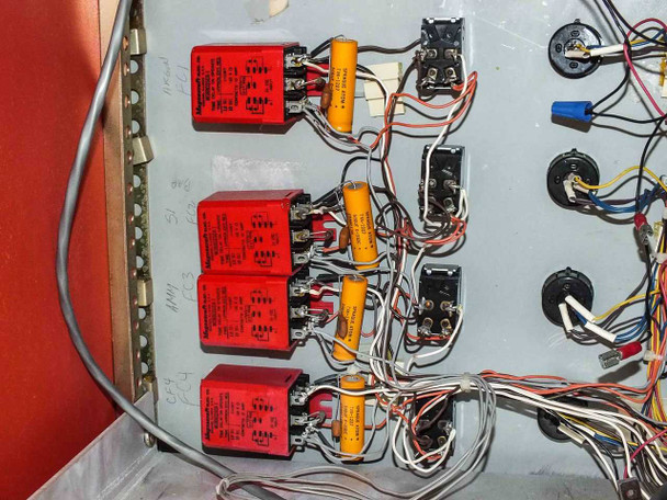 Technics West PE-IIGM Mass Flow Module interior close-up of four red relay modules with orange capacitors and associated control wiring
