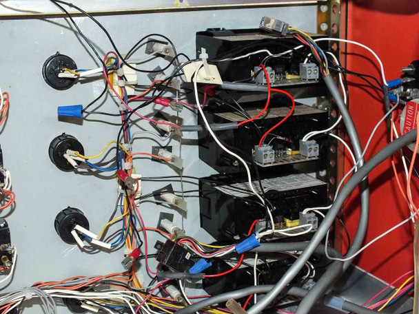 Technics West PE-IIGM Mass Flow Module interior right-side detail showing four stacked black control modules with multi-conductor wiring connections