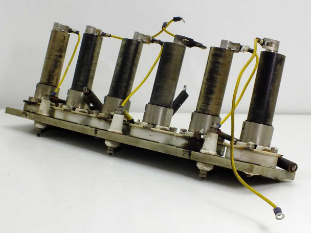 Solitron 7846 C664 solid state rectifier assembly — side angle view showing all 6 units with yellow lead wires and ceramic base sockets on PCB