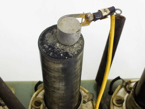 Close-up of Solitron 7846 solid state rectifier top showing aluminum cap, oxidation, and yellow wire lead connection