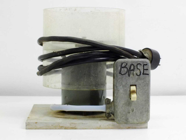 Unbranded disk spinner chamber side view showing BASE switch box with toggle switch, clear bowl, and power cord routing