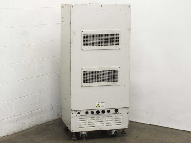 USHIO B0048 UV Flash Power Supply – rear exterior view showing two ventilation grille panels, high-voltage warning label, and output connection ports at base on casters