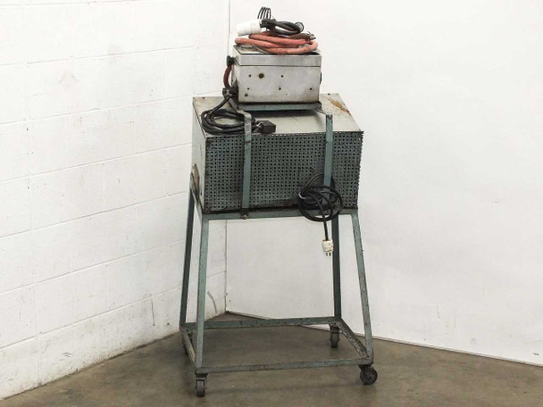 Eimac 2901 tube induction heater on cart – rear/side view showing perforated lower enclosure panel and power cable exiting the base