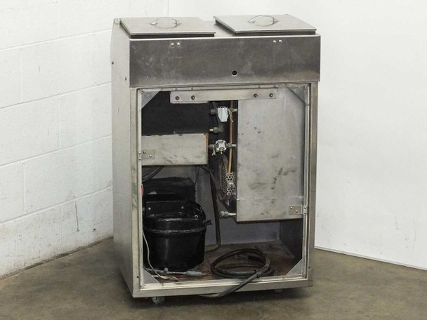 Tronic MK IV bath tank rear view with access panel removed exposing compressor and internal components