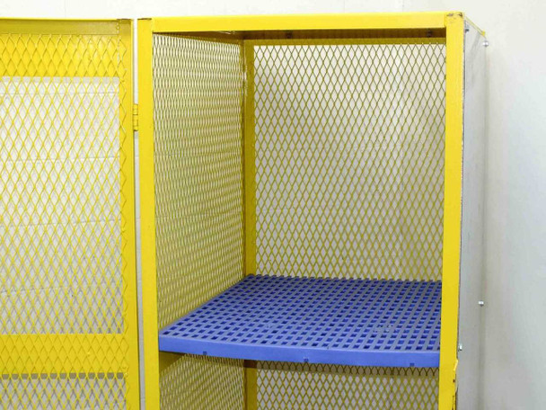 Interior upper section of Jamco CA080 cabinet with blue perforated plastic shelf installed