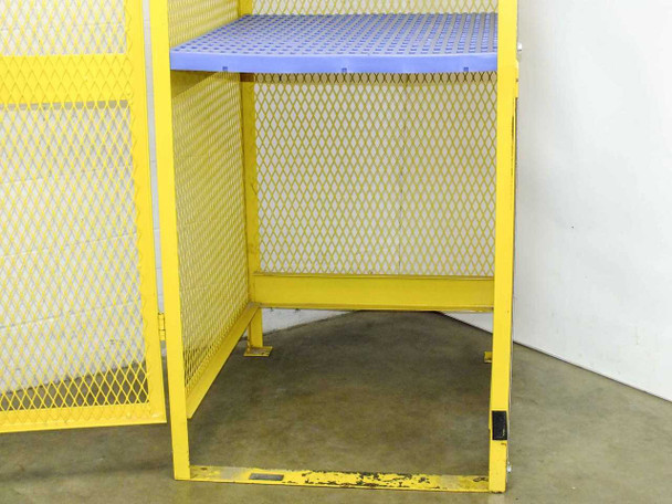 Lower section interior of Jamco CA080 cabinet showing base and bottom of blue plastic shelf from below