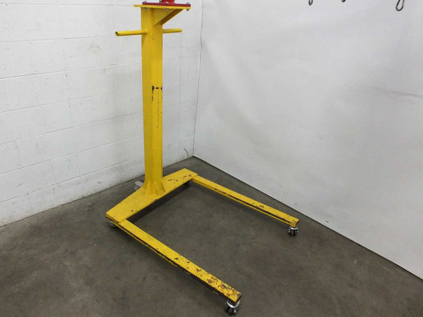 Thern 5122 yellow wheel base side angle view – caster wheel base showing paint wear and floor-level casters