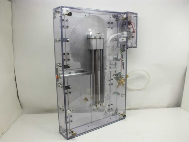 Exair 110018SS air knife housing – right side view showing internal pneumatic cylinder, large circular metal disc, and internal components through clear acrylic panels