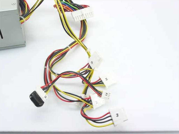 Dell 1E115 ATX power supply – close-up of output cable connectors including Molex and Berg connectors