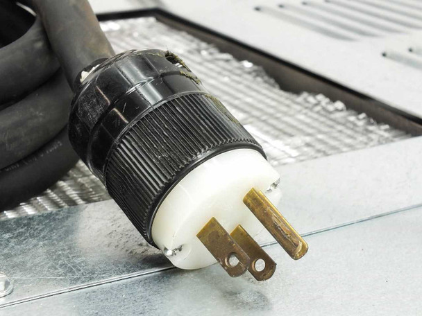 Elkay ER10-1B power cord close-up showing NEMA L5-15P twist-lock plug and condenser grille in background