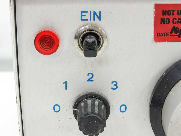 Close-up of Kramer Scientific 150H front panel controls — red indicator light, EIN toggle switch, and stepped intensity knob positions 0 through 3