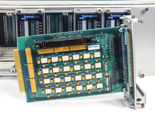 First Light Technology 24 Channel Input Card P/N visible on card face with S/N 1099 label and relay array components on green PCB