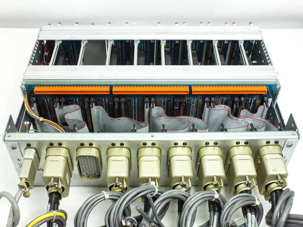 Rear of chassis showing full row of seven multi-pin military-style circular connectors with orange backplane terminal strip visible above