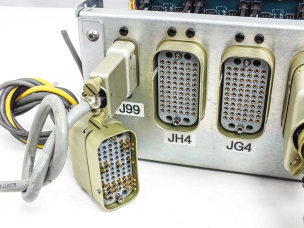 Close-up of rear connector panel showing J99, JH4, and JG4 multi-pin military-style connectors with mating cable plug in foreground