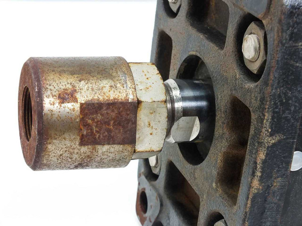 SMC CDA1FN100-G0547-25 threaded rod end closeup showing surface rust on bronze/brass hex coupling and black rod