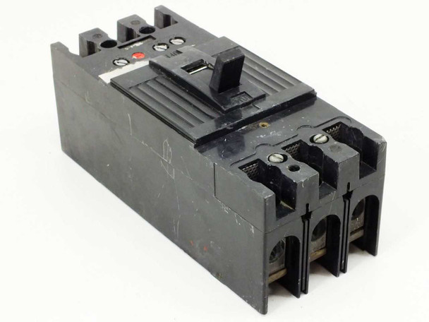Unbranded 3-pole MCCB circuit breaker — front right angle view showing red trip indicator button and toggle handle