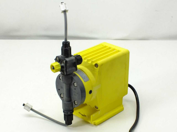 LMI Milton Roy P121-358SI dosing pump — left side view showing grey diaphragm pump head, injection valve assembly with yellow fittings, and power cord