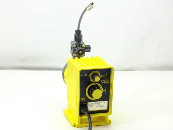 LMI Milton Roy P121-358SI electromagnetic dosing pump — front panel view showing yellow housing, LMI logo, NSF mark, stroke dial, speed knob, and discharge tubing