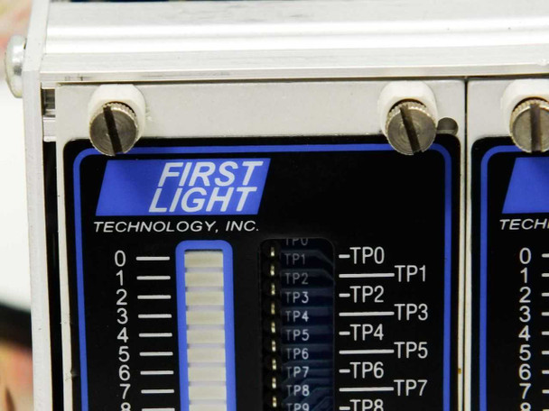 Close-up of First Light Technology Inc card face showing brand logo and test point labels TP0 through TP9