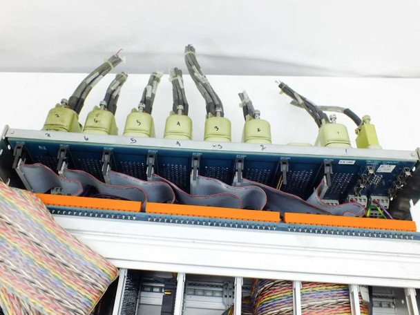 Top-down view of First Light Technology chassis showing rear multi-pin connectors and internal ribbon cable routing on backplane