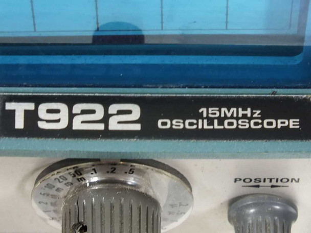 Tektronix T922 model badge close-up — T922 15MHz Oscilloscope lettering on front panel bezel with SEC/DIV and POSITION knobs visible below