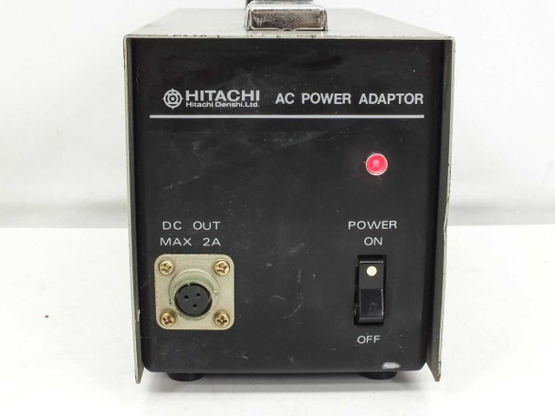 Hitachi AP-60U AC Power Adaptor front panel closeup showing Hitachi Denshi Ltd logo, DC Out Max 2A connector, and Power On/Off switch