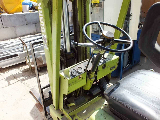 Clark C500-30 forklift – operator compartment showing steering wheel, instrument gauges, and seat