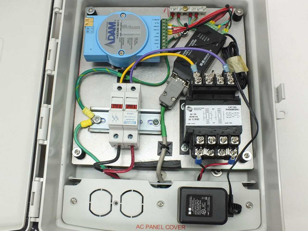 Interior of ADAM-4011 enclosure showing ADAM-4011 module, B&B 4WSD9OTB converter, Hammond transformer, Ferraz fuse block, terminal strips, and wiring
