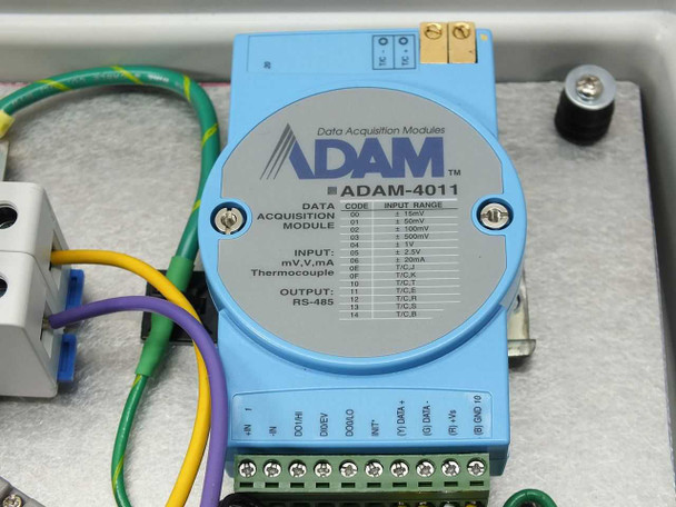 Close-up of Advantech ADAM-4011 Data Acquisition Module label showing input codes for thermocouple, mV, V, mA, and RS-485 output
