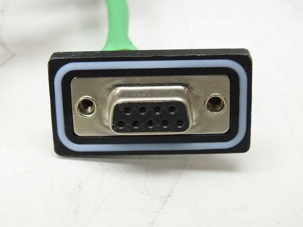 Close-up of DB-9 female connector on external green cable exiting the enclosure