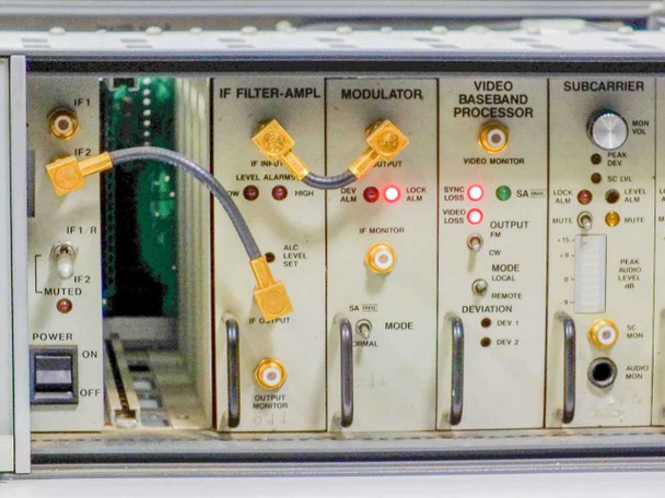 Scientific Atlanta 7550B plug-in module section showing IF Filter-Amplifier, Modulator, Video Baseband Processor, and Subcarrier modules with gold SMA connectors and LED indicators