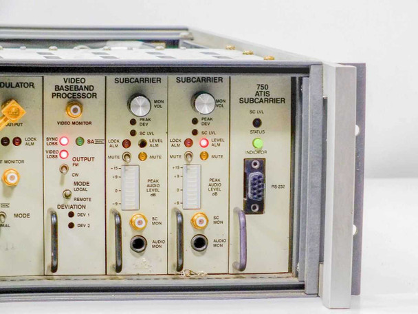 Scientific Atlanta 7550B plug-in module section close-up showing Modulator, Video Baseband Processor, two Subcarrier modules, and 750 ATIS Subcarrier module with RS-232 DB9 port