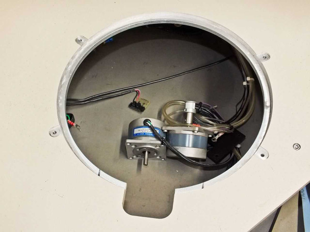 Interior view of PWS P5NMS wafer chuck cavity showing stepper motor, vacuum tubing, and wiring harness below the chuck surface