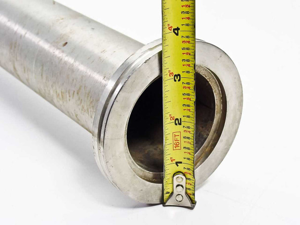 NW63 stainless vacuum tube flange end measured with tape measure showing approximately 2.5 inch outside diameter and bore opening