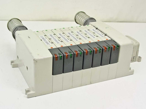 SMC EX250-SDN1 valve manifold — front view showing 9 individual solenoid valve modules with red and green LED indicators on manifold rail