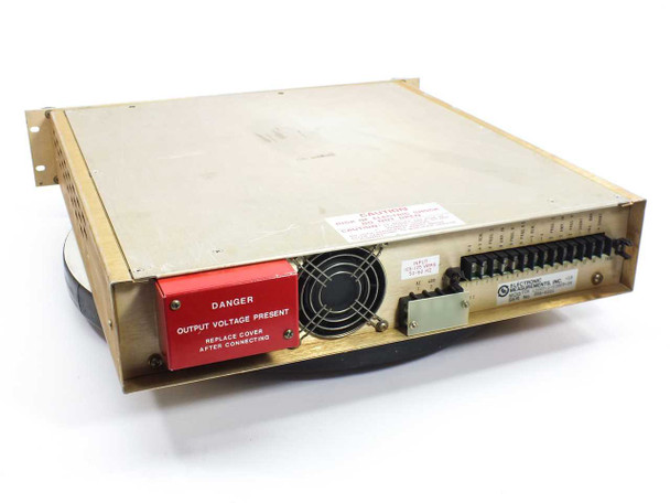 Electronic Measurements EMI TCR 150S7 DC Power Supply rear view — exhaust fan, terminal block, DANGER OUTPUT VOLTAGE PRESENT warning label, and EMI model label