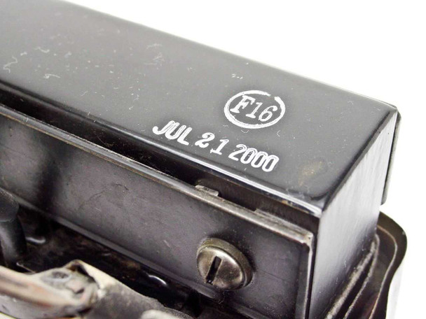 Bottom corner of Transformer Engineering TEC-180A inductor showing manufacture date stamp JUL 21 2000 and F16 inspection mark