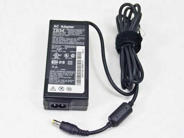 IBM 92P1021 AC adapter front view with rating label, figure-8 AC inlet, and yellow-tip barrel plug output cable