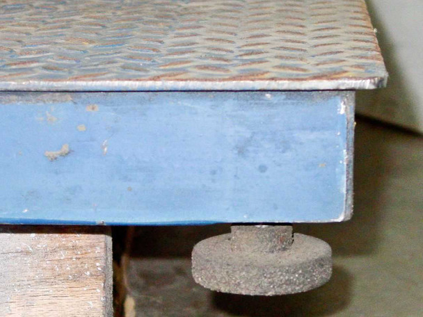 Totalcomp T4X4-6K floor scale — close-up of corner showing adjustable leveling foot and blue steel frame construction
