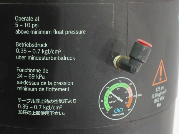 Newport I-2000 isolator leg pressure label — showing operating pressure 5–10 psi above float, max 125 psi, with gauge and air fittings