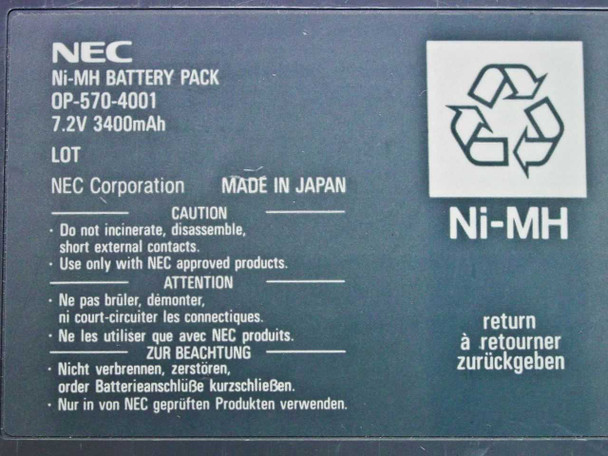 NEC OP-570-4001 battery label close-up showing 7.2V 3400mAh rating, NEC Corporation, Made in Japan, and multilingual caution text