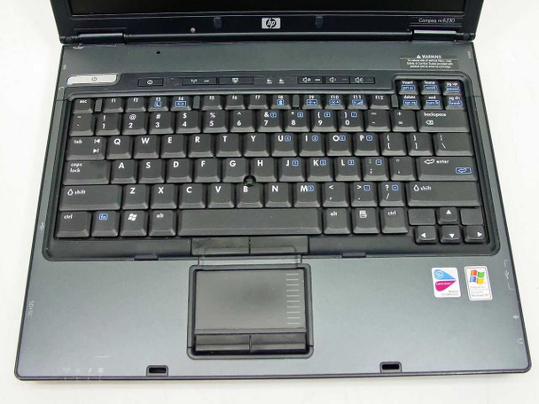 HP Compaq nc6230 – top-down view of keyboard and touchpad with Compaq nc6230 badge visible on lid