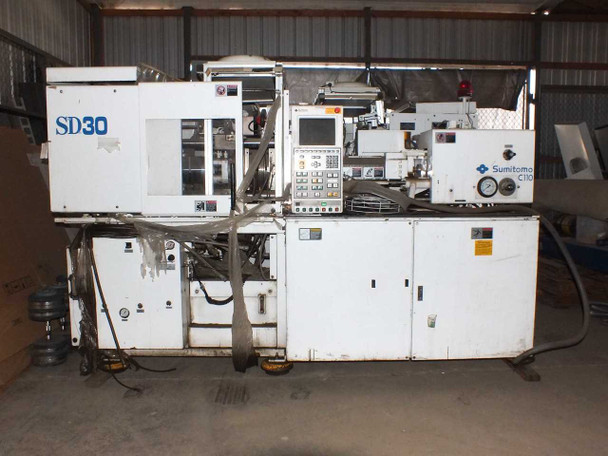 Sumitomo SD30 injection molding machine – wider view inside warehouse showing full machine profile with control panel