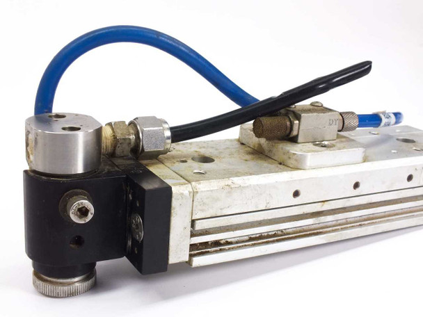 SMC MXS12-75 Pneumatic Slide Table end view showing cylinder end cap, port fittings, and solenoid body