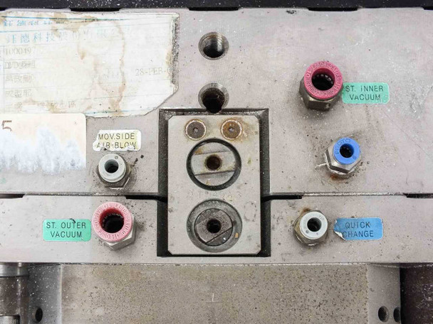 Close-up of mold top port panel showing MOV. SIDE AIR-BLOW, ST. INNER VACUUM, ST. OUTER VACUUM, and QUICK CHANGE labeled fittings