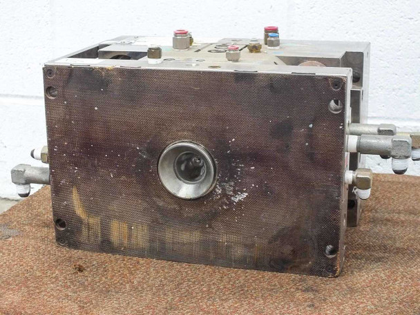 Meiki MDMI injection mold second bottom/side surface view showing gate nozzle opening and surface rust and discoloration