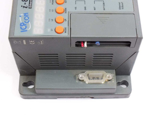 ICP DAS I-8KE8-G controller side and bottom view showing RS-232 COM1 port, +VS and GND terminals, INIT and INT/COM connectors, and Ethernet 10BaseT port