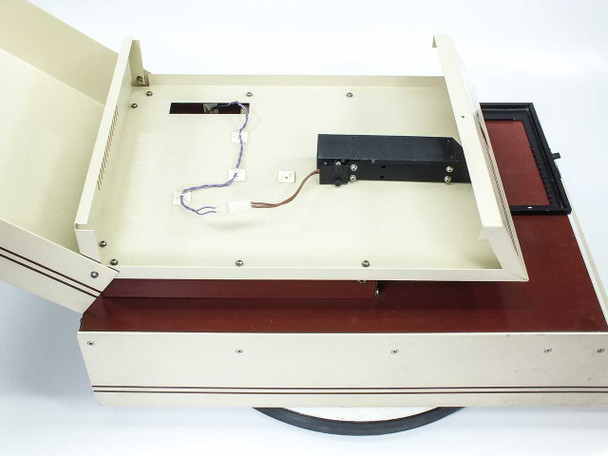 API UniScept Plus Autoreader – interior view with lid fully open showing optical scanning mechanism, wiring harness, and panel tray
