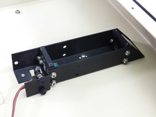 API UniScept Plus Autoreader – internal optical reader/lamp assembly detail showing light source holder, wiring, and mounting bracket