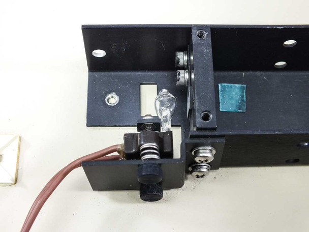 API UniScept Plus Autoreader – close-up of internal lamp assembly with bulb installed in holder and wire leads visible